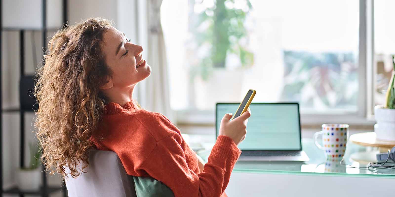 Smiling, relaxed professional enjoying a stress-free job search using AI tools